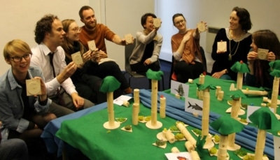 Photograph of a group of people playing a game related to rainforests.
