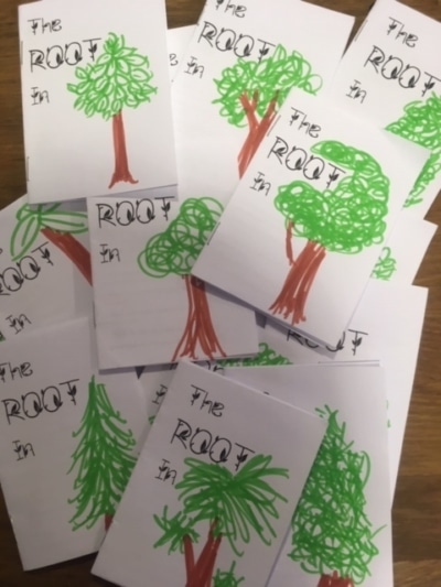Photograph of paper booklets wiht trees drawn on them.
