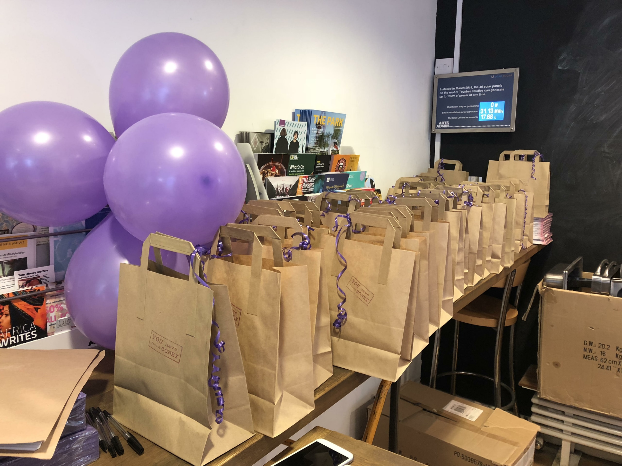 Photograph of a table full of goody bags.